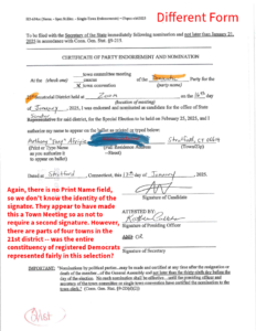 A small white dog sitting on top of a bed.