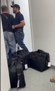 Fairfield registrar Matt Waggner "hip-checks" police officer